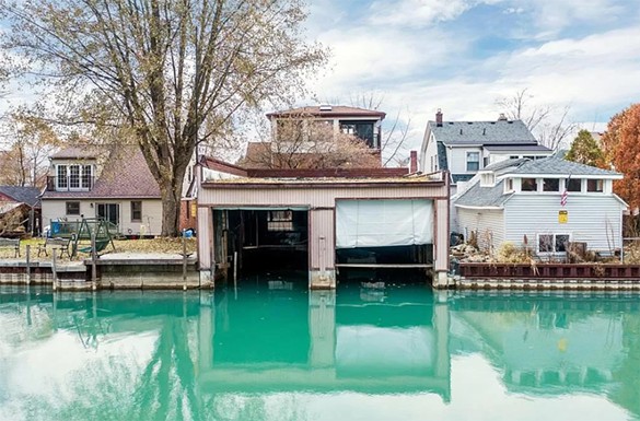 This Detroit canal house is business in the front, and party in the back