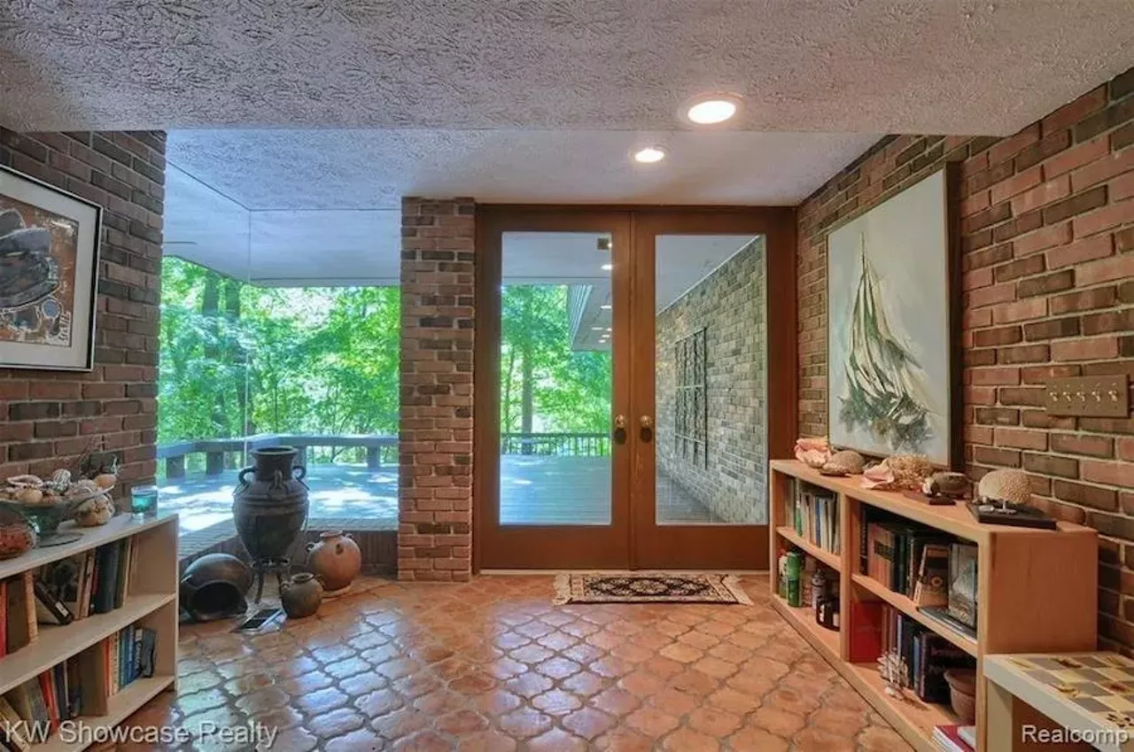 Image: This Frank Lloyd Wright-inspired waterfront home in Michigan has an artist loft, atrium, and waterfall