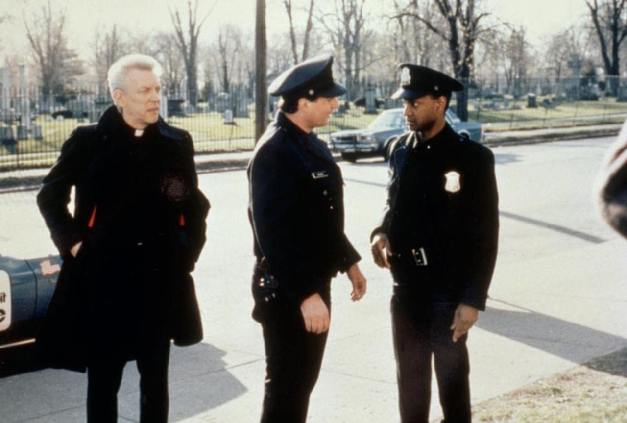 The Rosary Murders (1987)
Directed by Fred Walton. Written by Elmore Leonard and Fred Walton. Produced by Robert G Laurel.
While Leonard helped write the screenplay, the source material is a 1978 novel written by former Detroit Catholic priest and journalist William X Kienzle, making this the only instance of Leonard adapting someone else’s work to the screen. Starring Donald Sutherland, the story is also set in Detroit, involving a series of murders in a Roman Catholic parish with the killer leaving a black rosary in each victim’s hand. (Fun fact: A young, pre-fame Jack White makes an uncredited appearance as an altar boy.)