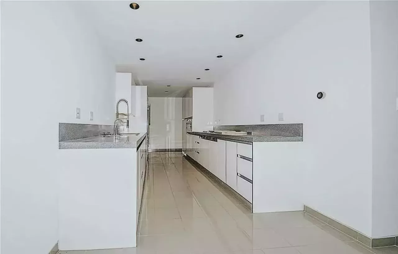 Image: This vertical Franklin Michigan home designed by Sigmund Blum is a modernist's wild dream &#151; and it keeps dropping in price