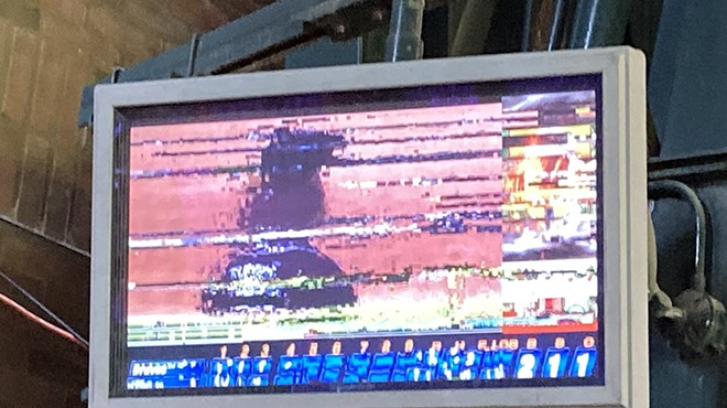 Some of the TV monitors at Comerica Park show freeze frames filled with static.