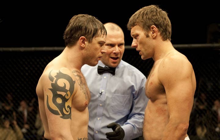 Tom Hardy (left) and Joel Edgerton hug it out in Warrior.