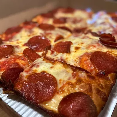 #20 Jet’s Pizza Multiple locations; jetspizza.com Jet&rsquo;s might not win over the Detroit-style purists, but it delivers a consistently tasty pizza straight to your doorstep&mdash;and that&rsquo;s tough to top. With over 400 locations nationwide, Jet&rsquo;s is the largest chain specializing in Detroit-style pizza, and when it comes to quality, it far outshines other Michigan-based giants like Little Caesars, Domino&rsquo;s, and Hungry Howie&rsquo;s. The brand takes creative liberties&mdash;placing sauce beneath the cheese and skipping traditional Wisconsin brick&mdash;but while that&rsquo;s a turnoff for some, it&rsquo;s still a flavorful, no-fuss option that beats most major delivery chains by a mile. Jet&rsquo;s doesn&rsquo;t skimp on cheese either. Its mozzarella-Muenster mix melts into gooey perfection with caramelized edges. The sauce is slightly sweet and light, the pepperoni crisps into classic cups, and the crust strikes a satisfying balance between soft and crisp without going soggy.