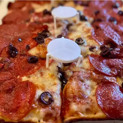 #24 Belle Isle Pizza 7869 E. Jefferson, Detroit; belleislepizza.com Belle Isle Pizza has been serving pies from a small, no-frills spot near Belle Isle since 2015. Under new ownership since 2023, their Detroit-style pizza is straightforward but falls short of the city&rsquo;s best. The crust is thinner than most Detroit-style pies, and while the edges have a satisfying crunch, the overall structure lacks heft. The tangy sauce leans acidic, which overpowers the cheese instead of balancing it. The flavor is there, but the execution felt a bit off. Still, it was a decent, satisfying pizza, but in a city with so many good options, this one doesn&rsquo;t quite measure up.