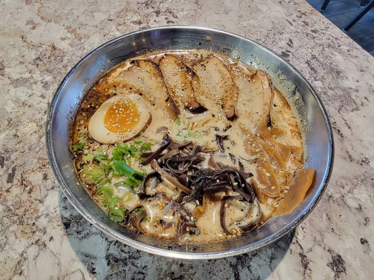 Image: Star among the offerings at Troy’s Shiromaru is the black tonkotsu.