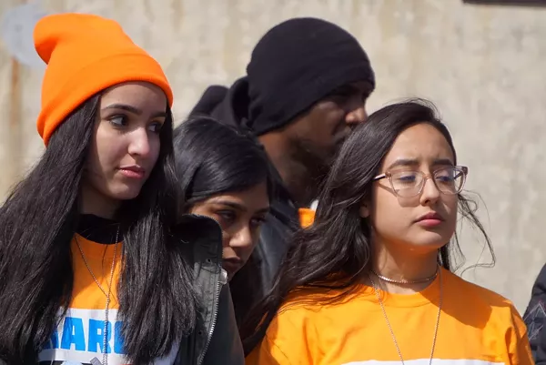 Cass Technical High School student Pamela Beltran (right) helped to organize the protest and spoke to a crowd of thousands. - Jay Jurma