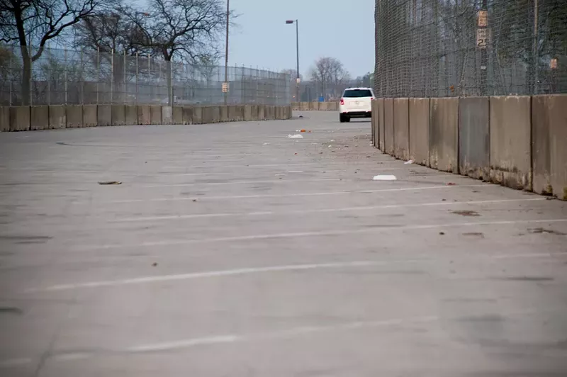 Concrete barricades and fencing on Belle Isle. - Tom Perkins