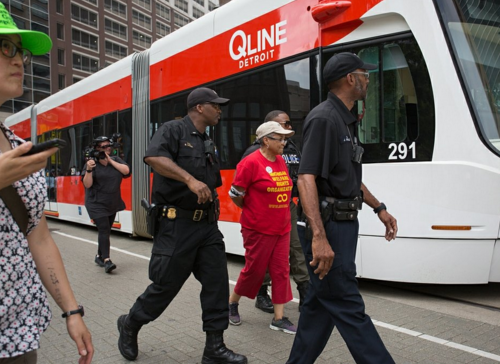 Nearly two dozen arrested for blocking QLine during water shutoff protest in Detroit