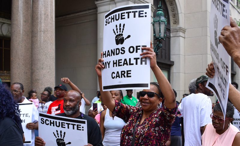 Protesters fight Michigan's Medicaid work requirements outside the Detroit office of gubernatorial candidate and Attorney General Bill Schuette. - COURTESY PHOTO