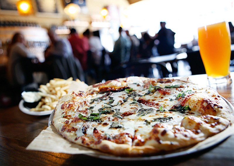 A Margherita pizza, truffle fries, and North Peak Diabolical IPA, from Jolly Pumpkin in Detroit. - Rob Widdis