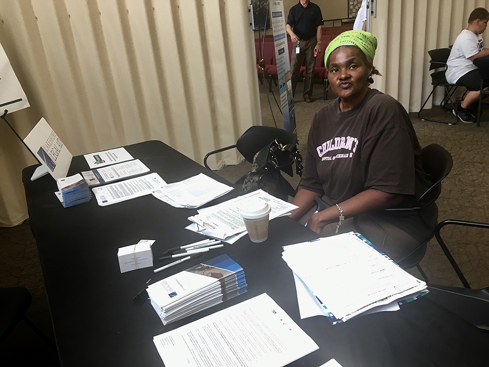 A renter living under a "ghost landlord" waits for legal help at an "escrow fair" put on by the city of Detroit. - Violet Ikonomova