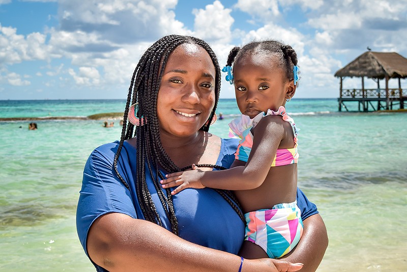 Siwatu-Salama Ra and her daughter pictured on vacation with her first child. - Courtesy photo