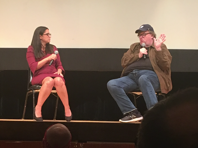 Dr. Mona Hanna-Attisha and Michael Moore speak at the premiere of Fahrenheit 11/9 in Flint. - Corey Hall