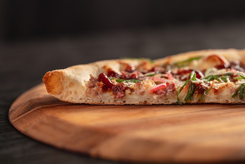 New York style pizza features a thin center crust with a crispy outer crust. - COURTESY OF MOOTZ PIZZERIA + BAR