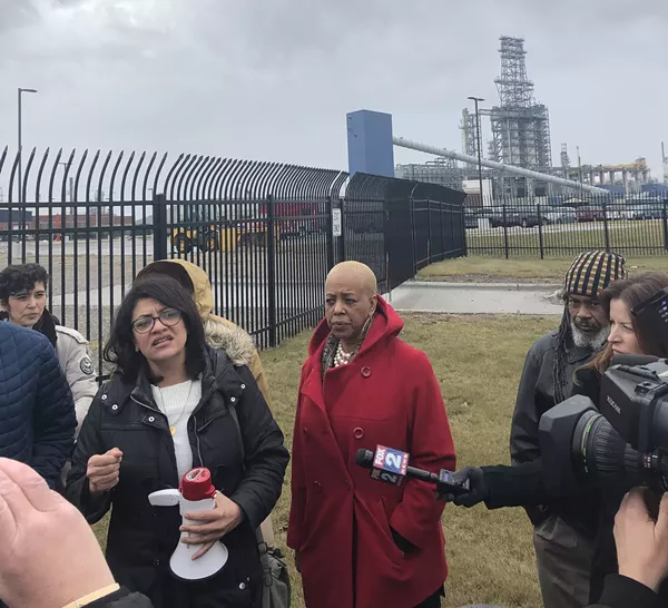 Rep. Rashida Tlaib and State Rep. Cynthia A. Johnson speak in front of protesters outside of the Marathon Petroleum Refinery in Southwest Detroit - Will Feuer