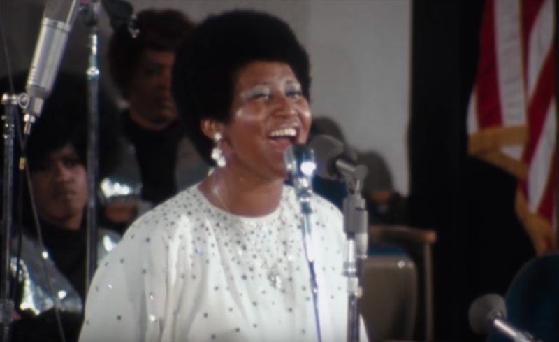 Aretha Franklin singing to the congregation at New Temple Missionary Baptist Church. - Youtube screen grab, distributed by Neon