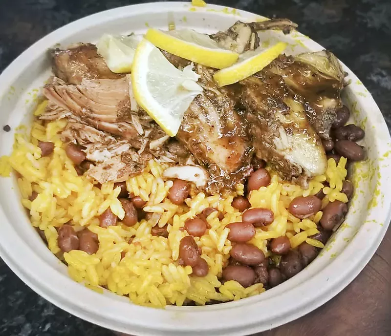 Jerk chicken with jollof rice. - Courtesy photo