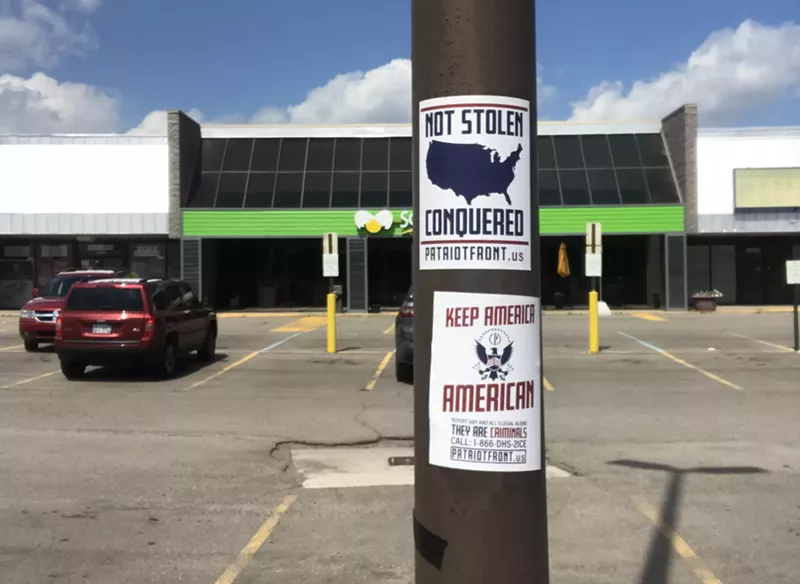 Patriot Front posters in a parking lot on 13 Mile Road near Little Mack Avenue in Roseville. - Collin Keen