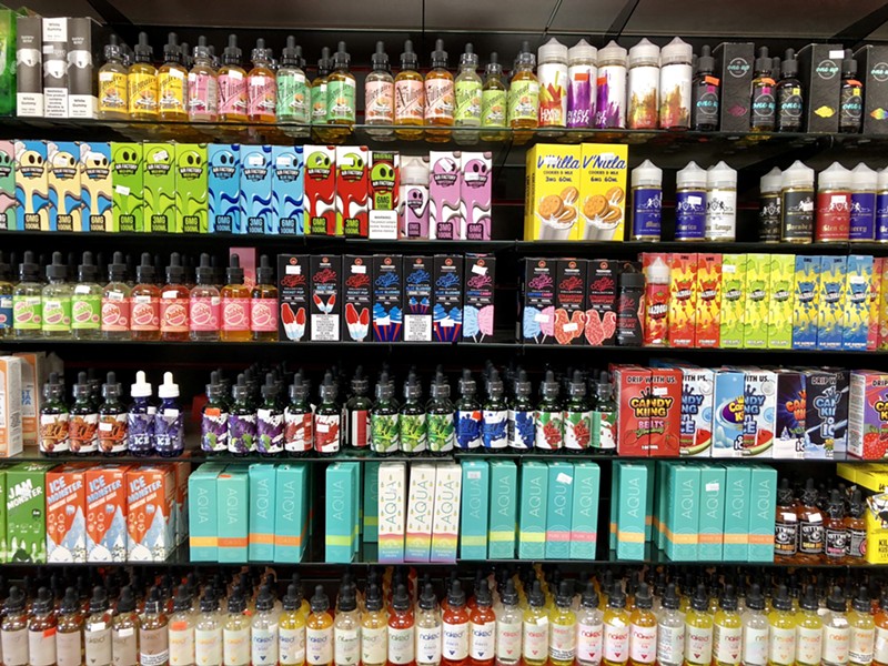 Flavored e-cigarette concentrates for sale at a Detroit store. Under Michigan's new ban, anyone possessing four or more "flavored vapor products or alternative nicotine products" faces a penalty of up to six months in jail. - Steve Neavling