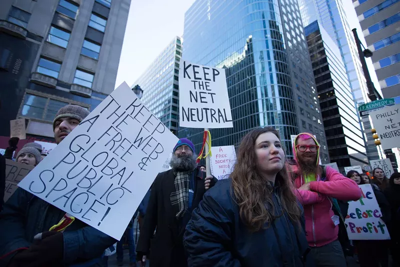 Protestors advocating for net neutrality rally outside the headquarters of the Comcast Corporation in Philadelphia, Saturday, Jan. 13, 2018. - Michael Candelori / Shutterstock.com