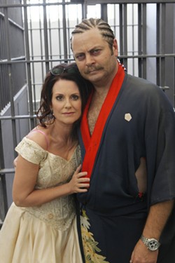 Megan Mullally and Offerman on the set of Parks and Recreation in 2011. - NBC