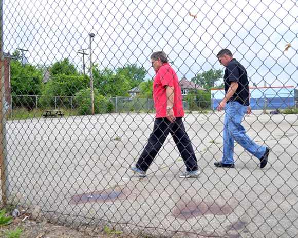 Detroit Assistant Police Chief Steve Dolunt (left) patrols the scene of a shooting on the city's west side. - Courtesy of Dustin Blitchok