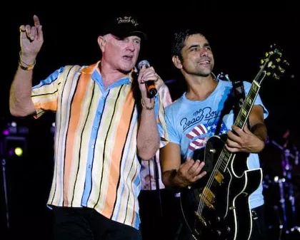 NOTE: John Stamos will not be joining the Beach Boys for their area show... or will he? - Gibson promotional photo