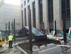 Crews work on building the retractable, glass rooftop that will cover the dining space at Townhouse, in this shot posted last month. - Facebook