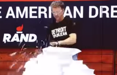 Rand Paul used a chainsaw, a wood chipper, and fire to destroy a 70,000-page copy of the tax code. But the only unusual thing one commentator found worth discussing was this T-shirt. - YOUTUBE