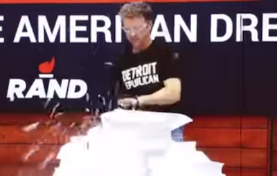 Rand Paul used a chainsaw, a wood chipper, and fire to destroy a 70,000-page copy of the tax code. But the only unusual thing one commentator found worth discussing was this T-shirt. - YouTube
