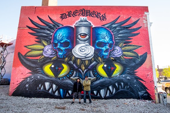Los Angeles-based artists Jeff Soto and Maxx242 stand in front of their finished mural for 1xRUN's Murals in the Market. - Sal Rodriguez