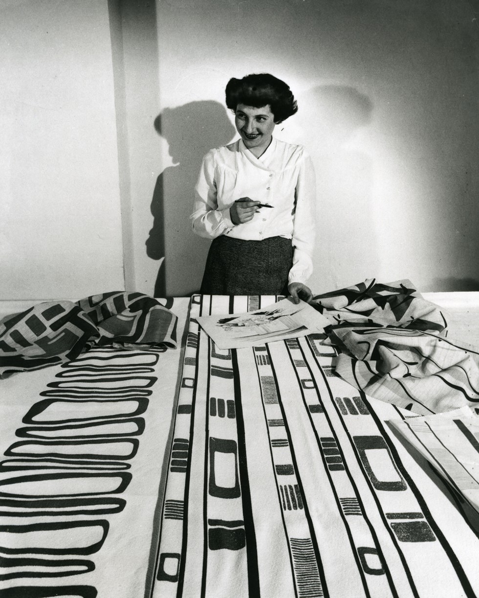 Ruth Adler Schnee working with designs. - Courtesy of Cranbrook Art Museum