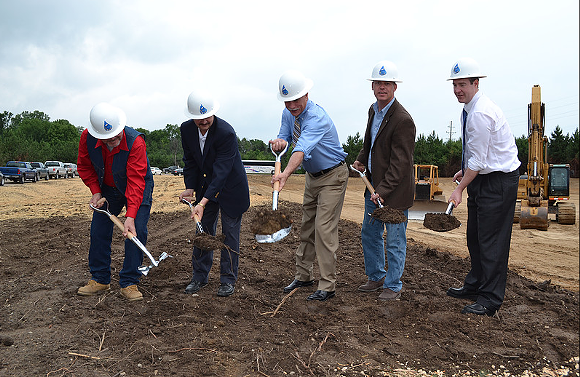 The men of the KWA, including Genesee County Drain Commissioner/KWA CEO Jeff Wright (center) and Flint Mayor Dayne Walling (far right) break ground for the new pipeline.