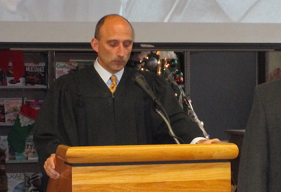 Judge Paul J. Paruk presiding over the inauguration of incoming and re-elected members of Hamtramck's City Council this January. - Photo by Michael Jackman