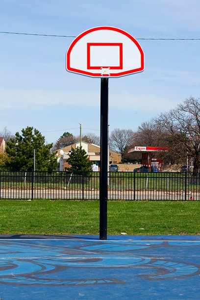 The city has begun removing basketball rims at parks to discourage clusters of people. - STEVE NEAVLING