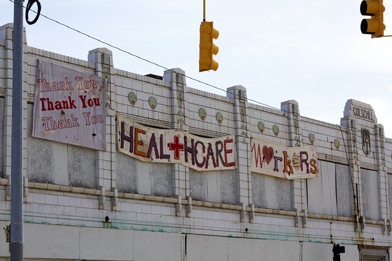 A sign of support for health care workers on the vacant Goeschel building on Gratiot in Detroit. - STEVE NEAVLING