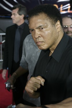 Muhammad Ali at the Los Angeles premiere of 'Collateral' held at the Orpheum Theatre in Los Angeles, USA on August 2, 2004 | Photo credit: Tinseltown / Shutterstock.com