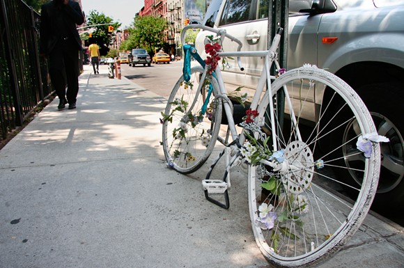 A ghost bike memorial for a killed cyclist in New York. - Shutterstock