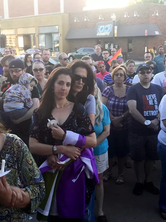 Katie Lamb, 28, left, with her wife Laura Quirk, 58, of Berkley, at a vigil held Sunday at Ferndale City Hall for victims of a mass shooting at Pulse nightclub in Orlando. - Photo by Dustin Blitchok.