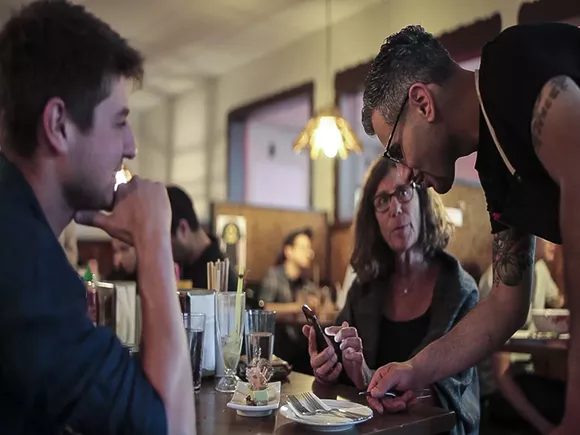 Flowers of Vietnam offers free meals for police who break bread with residents