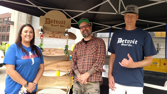 Jolly Pumpkin Pizzeria and Brewery General Manager Shelby Oberstaedt, Jolly Pumpkin Beer Label Artist Adam Forman and Detroit Surf Co. Owner Dave Tuzinowski celebrated their collaboration at the Detroit Luau Party on July 16. - COURTESY OF JOLLY PUMPKIN