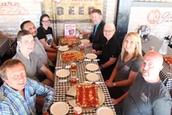 Mayor Karen Majewski and friends dig into the new Hamtramck Special at Buddy's Rendezvous. - Courtesy of Buddy's Pizza