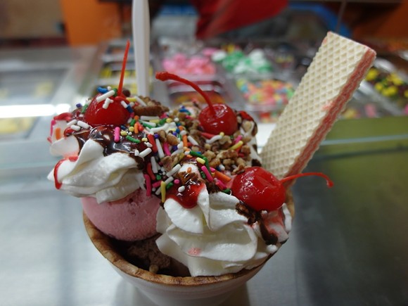 A Canasta Sundae, with ice cream, whipped cream, chocolate syrup, sprinkles, cherries, and vanilla wafers.