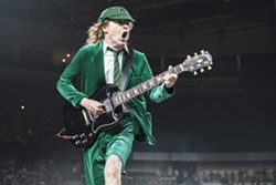 Angus Young shreds during Friday's AC/DC make-up date at the Palace. - Photo by Mike Ferdinande