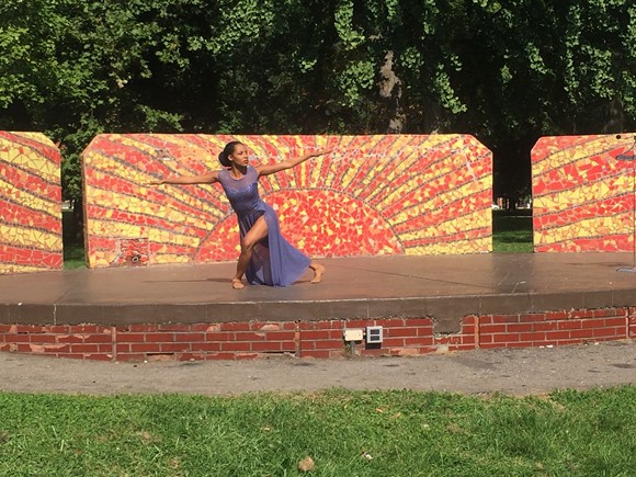 The Detroit-Windsor Dance Academy's Amber Moore performs "Crowned" during an Open Streets event at Clark Park on Tuesday. - PHOTO BY JENNIFER MCDONNELL.