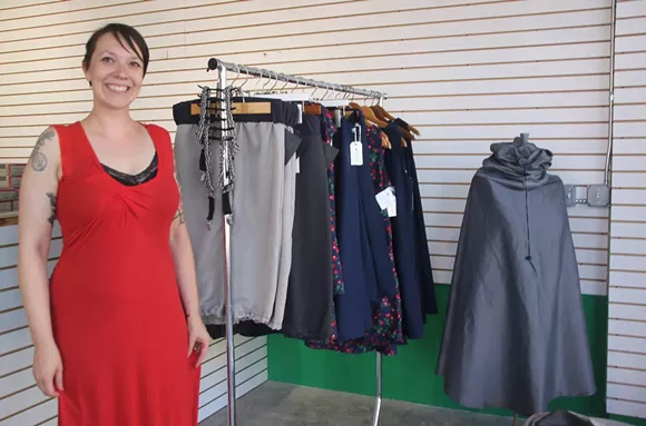 William + Bonnie owner Sarah Ayres stands with some clothing options that will be for sale at Wheelhouse Hamtramck.