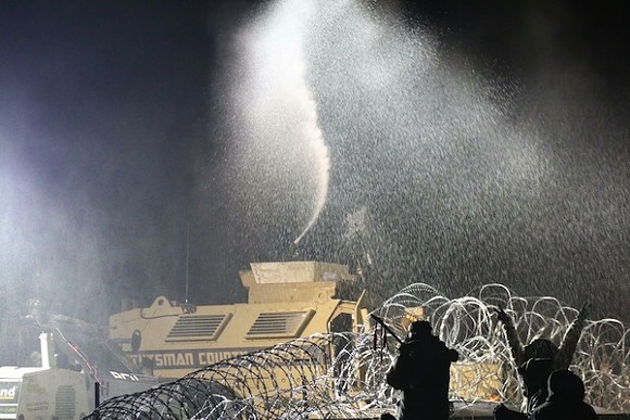 Among the arsenal of weapons deployed against protestors: water cannons in freezing weather. - Photo courtesy Sam Waldman