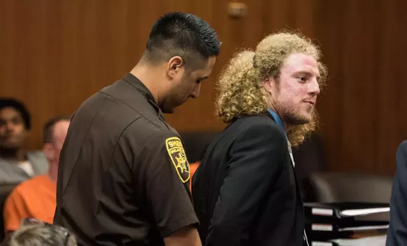 Activist Andrew Cissell stands in Oakland County Circuit Court on July 11 for sentencing on a conviction of illegal sale of medical marijuana. - Photo by Mike Ferdinande
