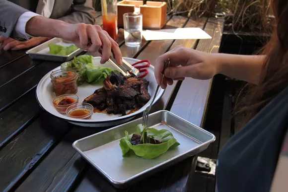 Gochujang, a Korean condiment made from red chiles, rice, - fermented soybeans, and salt, adorns a dish at Public House. - Photo by Sagen Isham