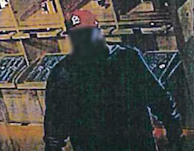 Blurry surveillance image of the suspect. - ACLU